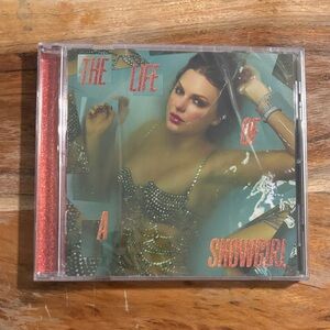 Taylor Swift The Life of a Showgirl CD with Teal Cover and Orange Glitter Spine